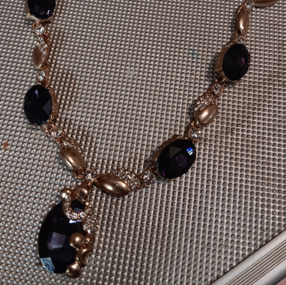 Gold chunky necklace with purple stones